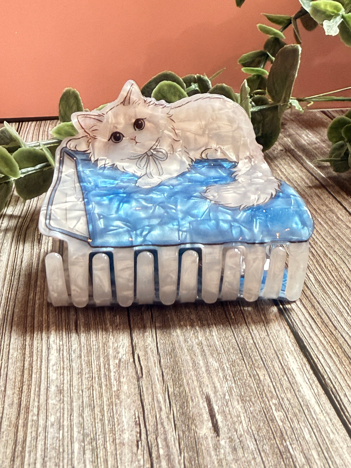 Cat on a book hair clip