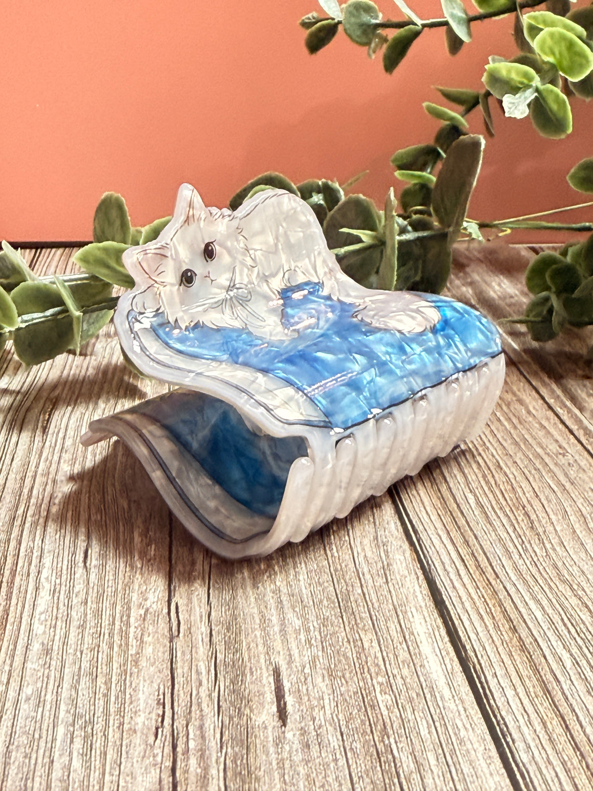Cat on a book hair clip